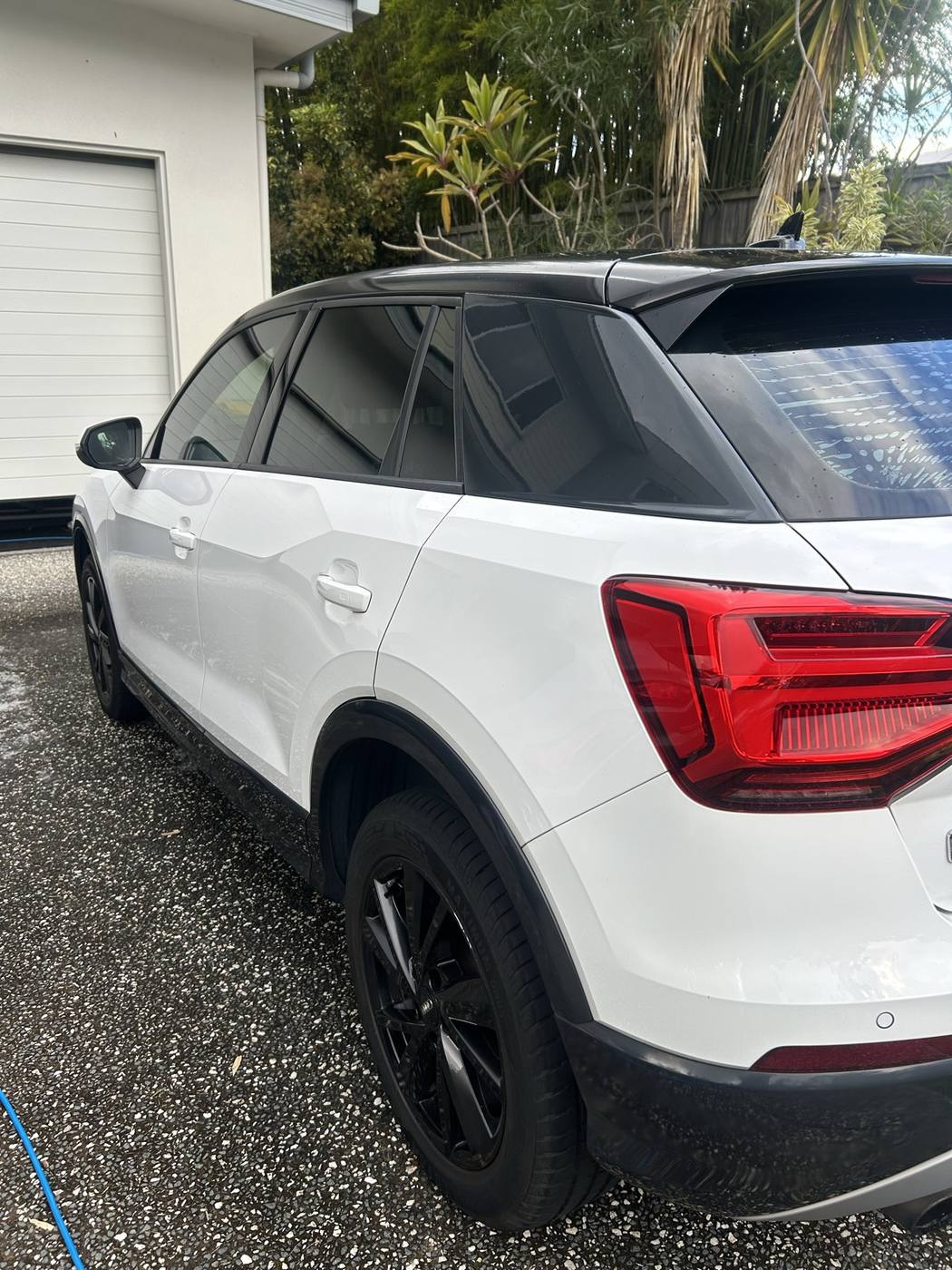 Audi Q2 side panel after detailing — clean, glossy white paint