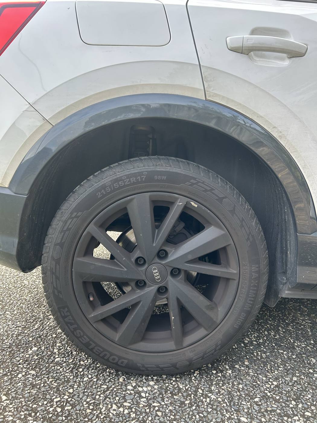Alloy wheel before detailing — brake dust and grime
