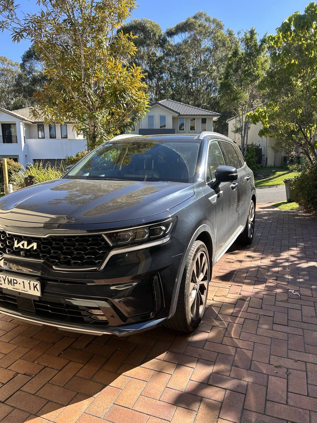 Kia Sorento before detailing — dull paint with dust and water spots