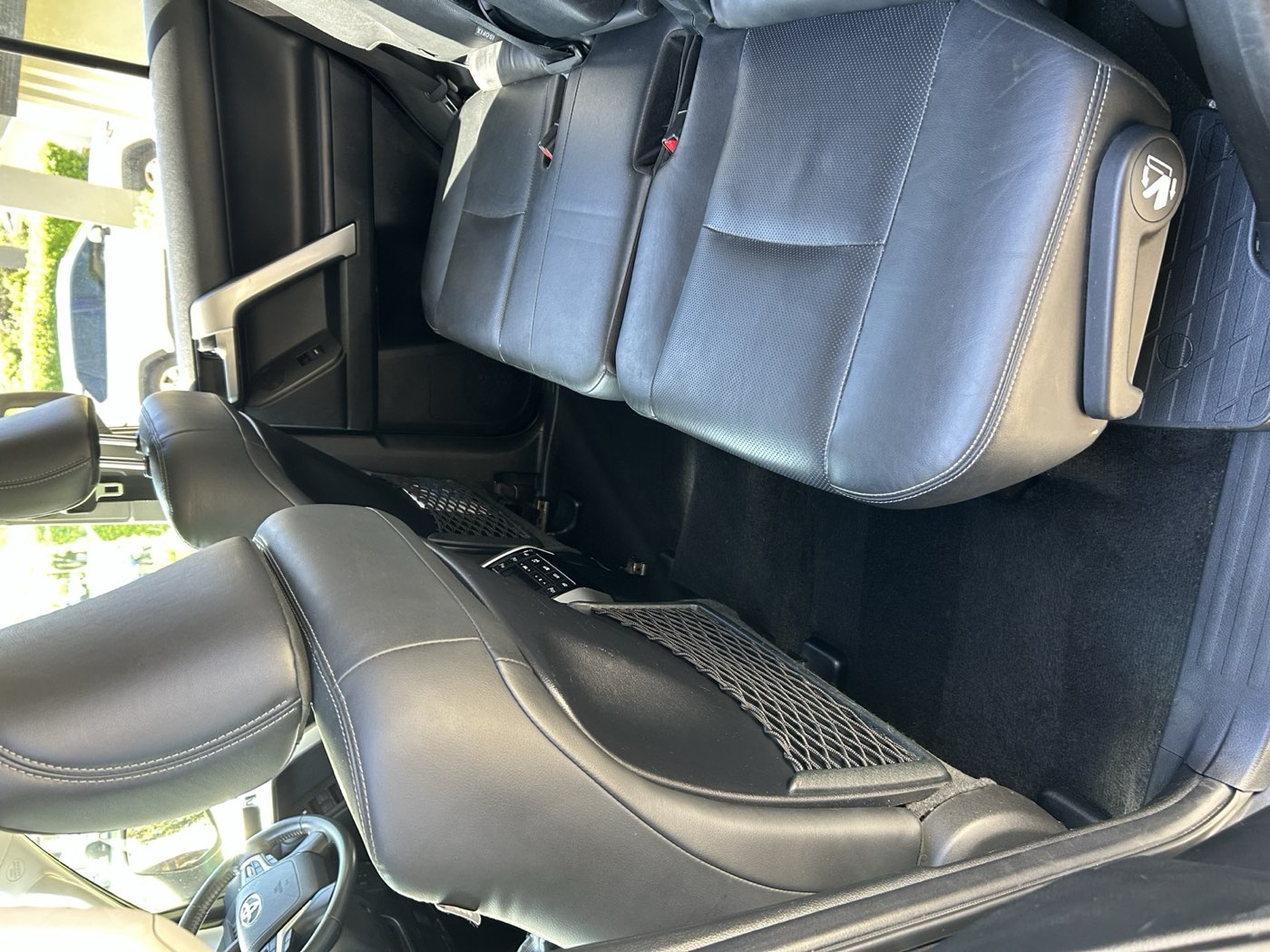 Car interior after detailing — spotless leather seats and carpet