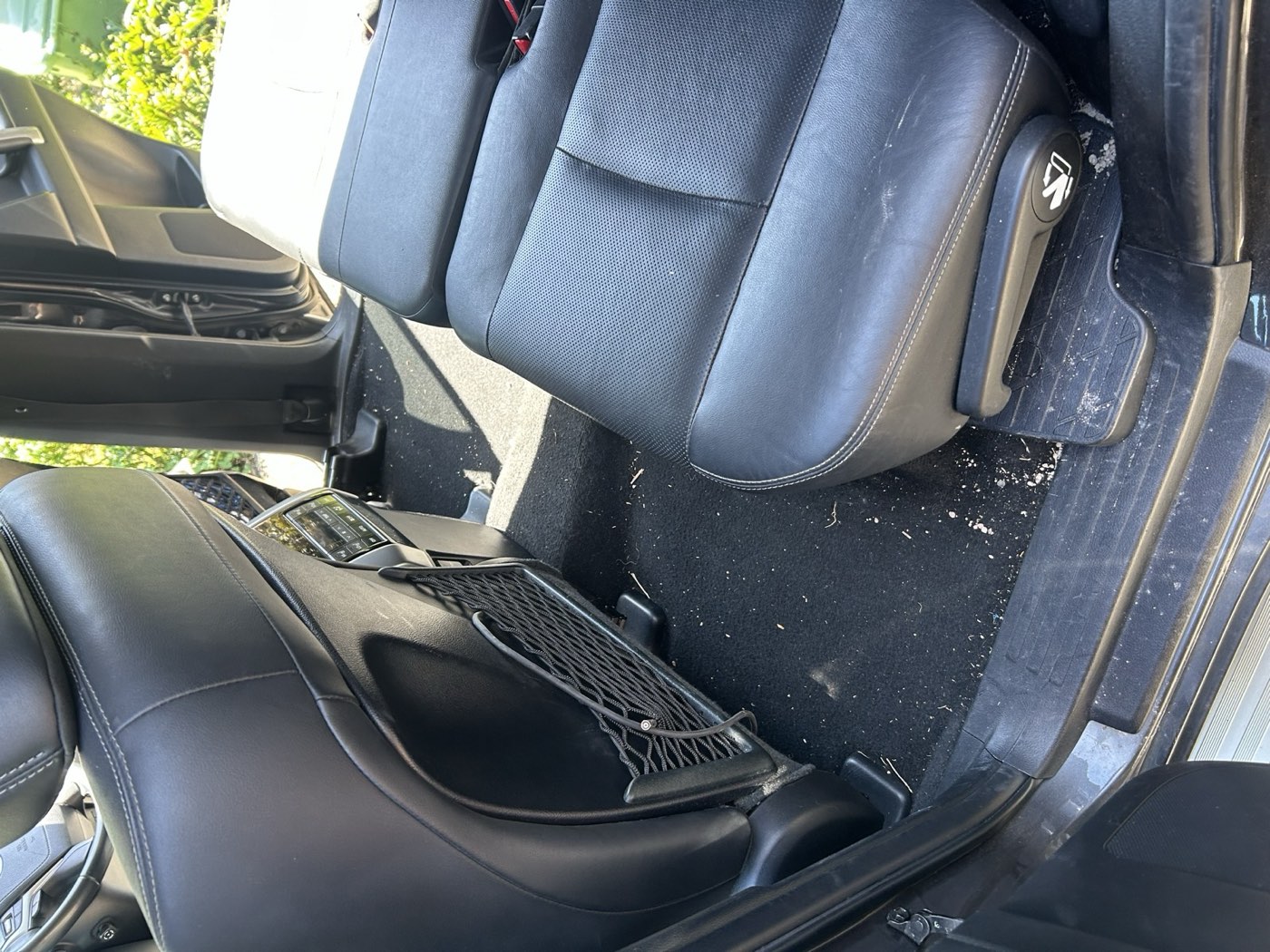 Car interior before detailing — dirty seats and carpet